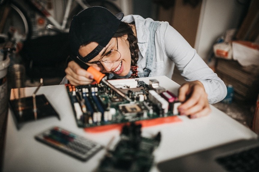 Lady working on computer motherboard