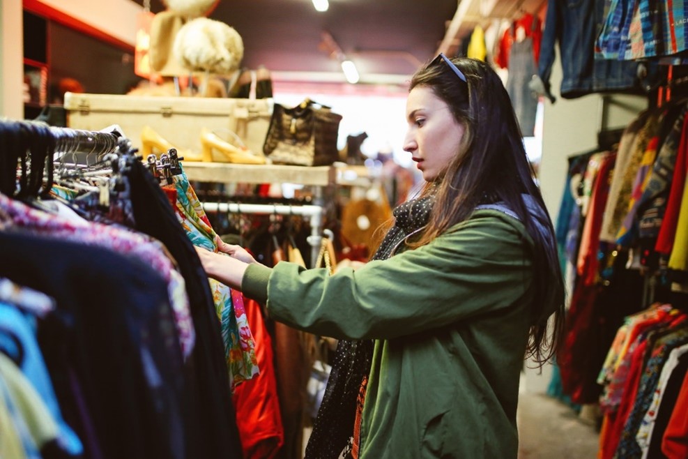 Women looking through clothes rack