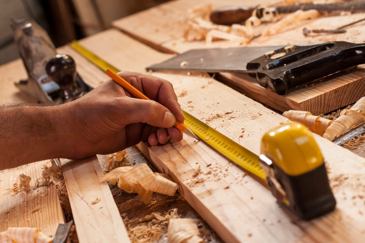 Carpenter taking measurement