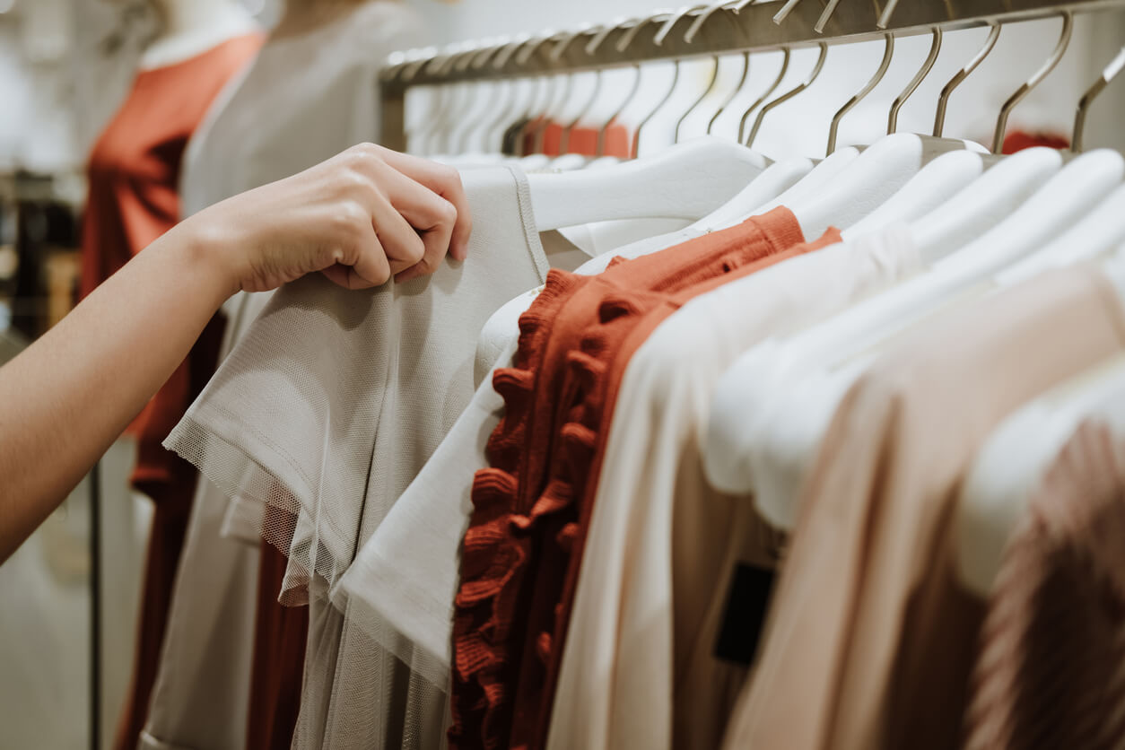 Looking through a clothes rack.